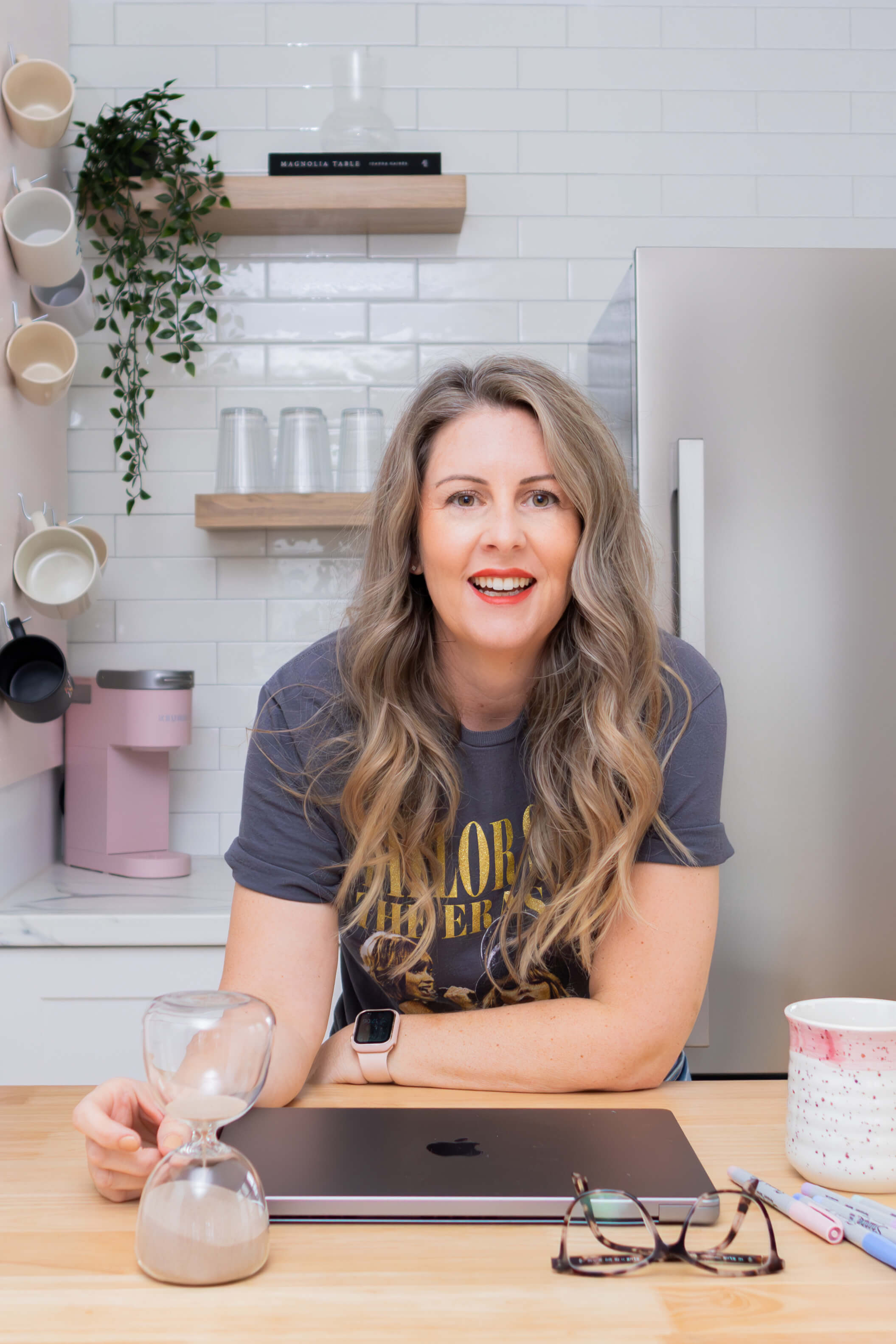 Professional headshot of a female business owner smiling at the camera